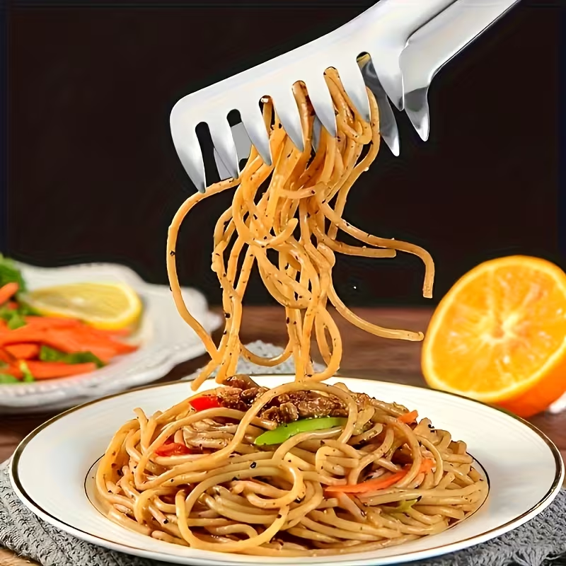 Stainless steel pasta tongs, suitable for buffets and family meals.