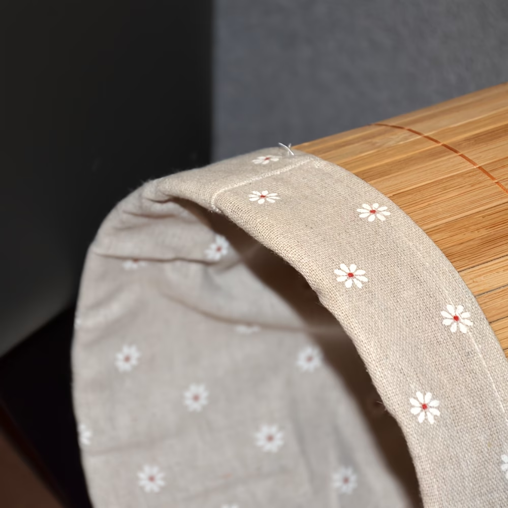 A rustic-style trash can, made of bamboo, with a minimalist design.