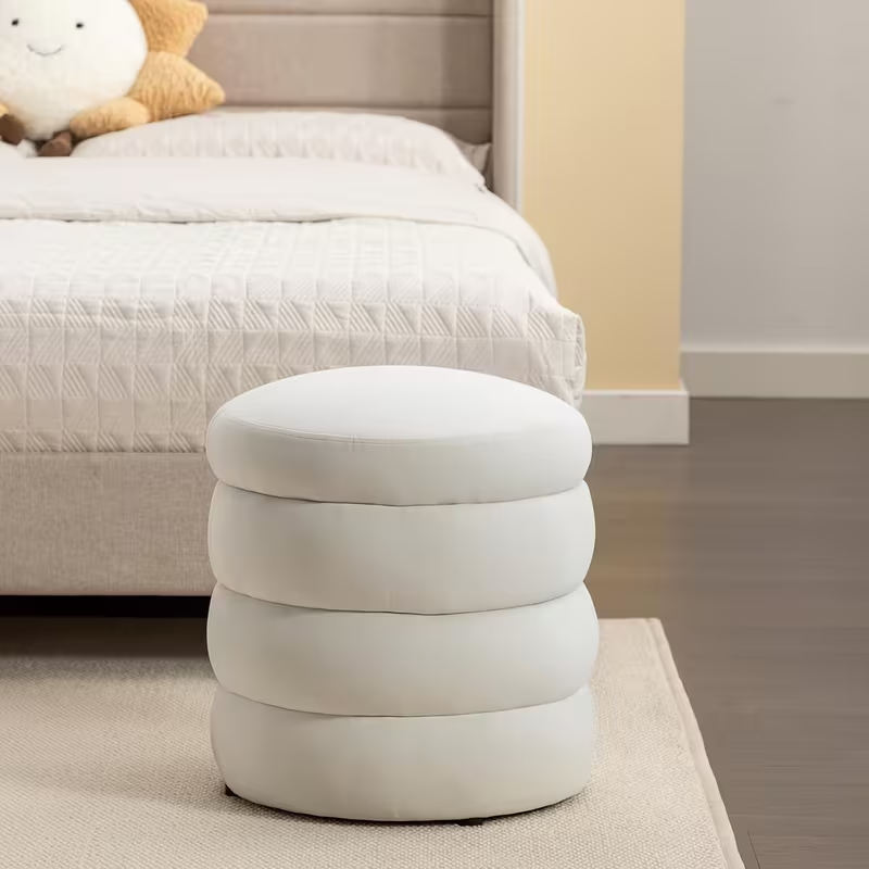 Round, cushioned vanity stool/footstool, 16.93 inches wide and 18.5 inches high.