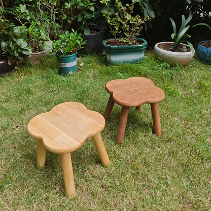 A retro-style creative solid wood clover shoe stool