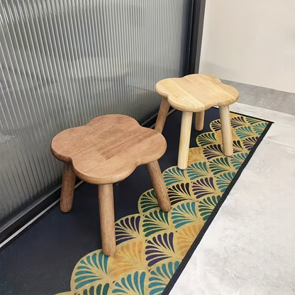 A retro-style creative solid wood clover shoe stool